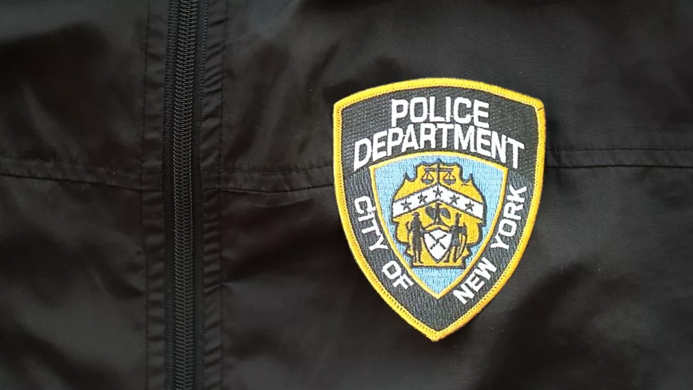 NYPD Police patch on black jacket uniform close up