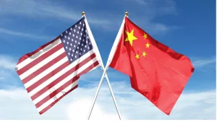American and Chinese flags on cloudy sky. waving in the sky