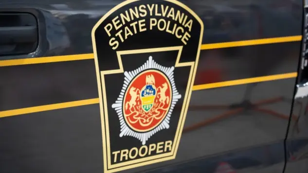 The Pennsylvania State Police Trooper emblem^ on display at the annual PA Farm Show. Harrisburg^ PA / USA - January 8^ 2020