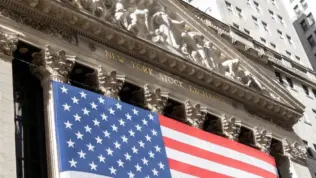 Grand American flag displayed on the facade of the New York Stock Exchange in downtown Manhattan. New York^ NY^ USA - 11.05.2024