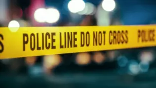 Yellow Tape Showing Text "Police Line Do Not Cross" Restricting a Crime Scene Area At Night. Close Up Aesthetic Shot with Bokeh Effect and Flickering Lights. Criminal on the Loose Strikes Again