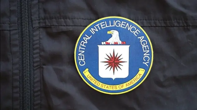 United States of America Central Intelligence Agency coat of arms as pin on black uniform jacket close up