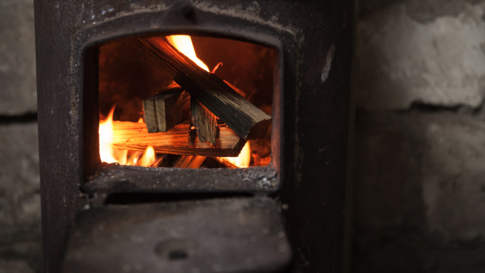 fire-burning-in-small-black-iron-stove