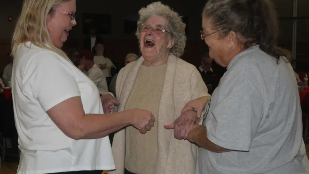 laverne-hurd-in-center-with-direct-care-supervisor-tina-equitz-and-direct-support-professional-priscilla-davidson