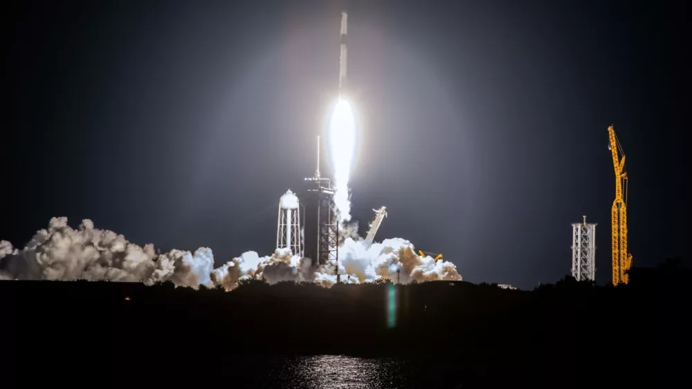 SpaceX rocket Falcon 9 rocket capsule soars upward after lifting off from launch pad. Digitally enhanced. Elements of this image furnished by NASA.