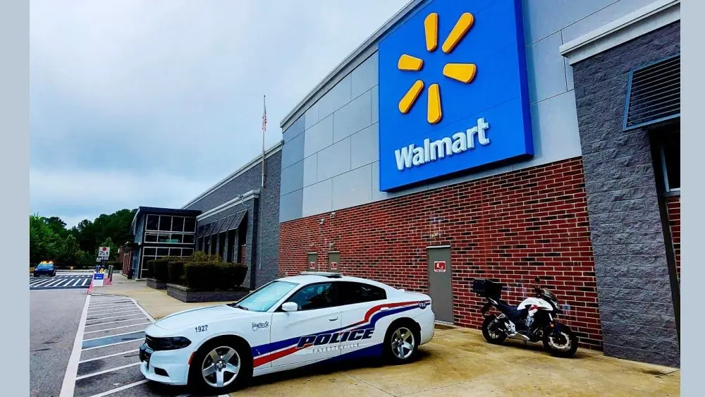 Police car parked in front of Walmart Store^ Fayetteville^ North Carolina^ USA^ August 6^ 2025