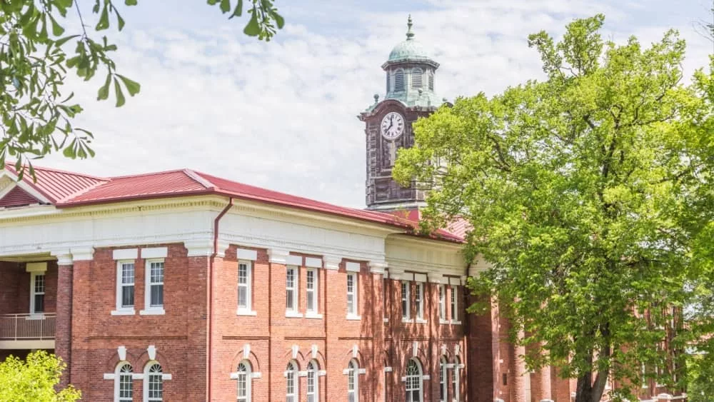 Clock Tower Atop White Hall: Historic clock tower atop White Hall on the campus of Tuskegee University. TUSKEGEE^ ALABAMA - MARCH 28^ 2019