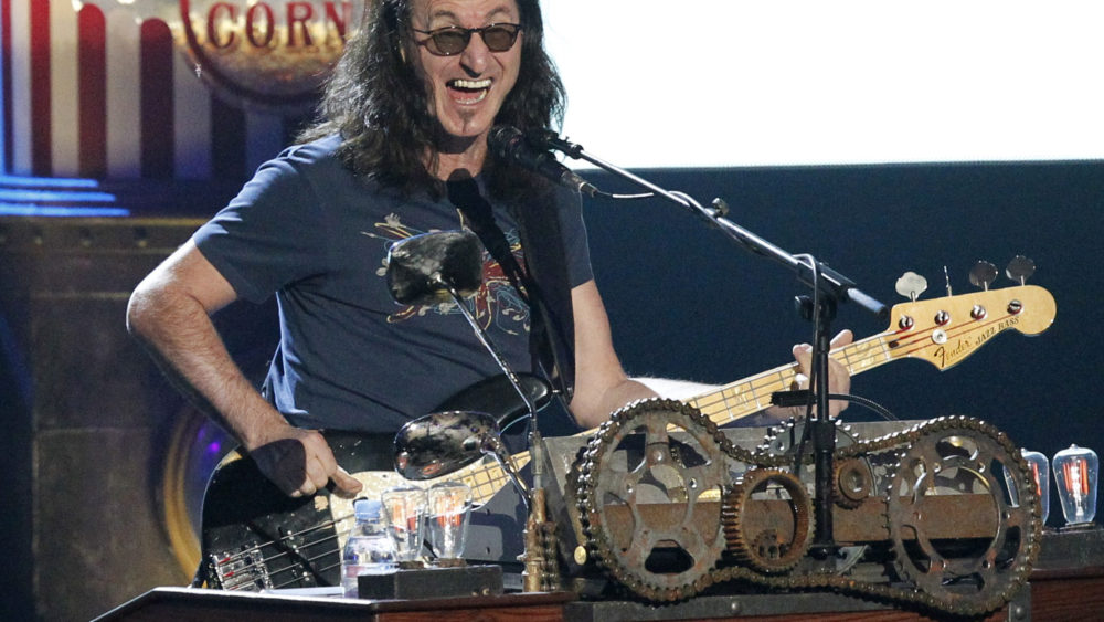 geddy-lee-of-rush-performs-during-his-bands-induction-at-the-2013-rock-and-roll-hall-of-fame-induction-ceremony-in-los-angeles
