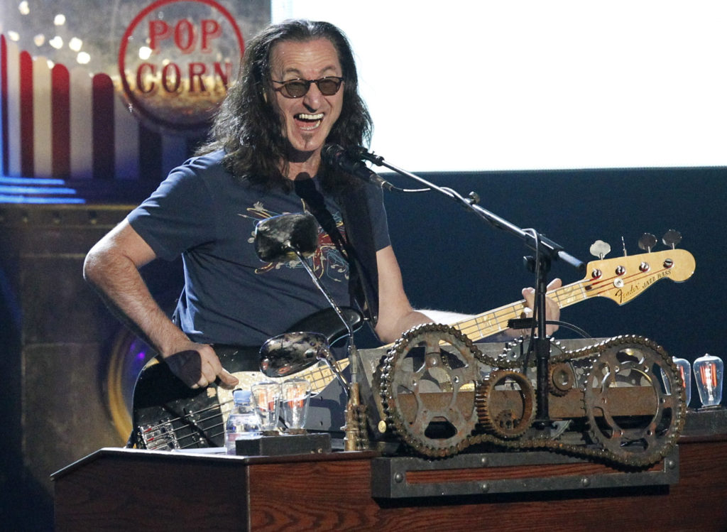 geddy-lee-of-rush-performs-during-his-bands-induction-at-the-2013-rock-and-roll-hall-of-fame-induction-ceremony-in-los-angeles-2