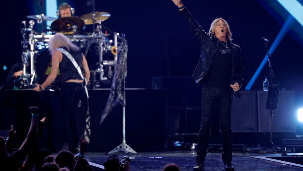 lead-singer-joe-elliott-r-performs-with-def-leppard-during-the-iheartradio-music-festival-at-t-mobile-arena-in-las-vegas