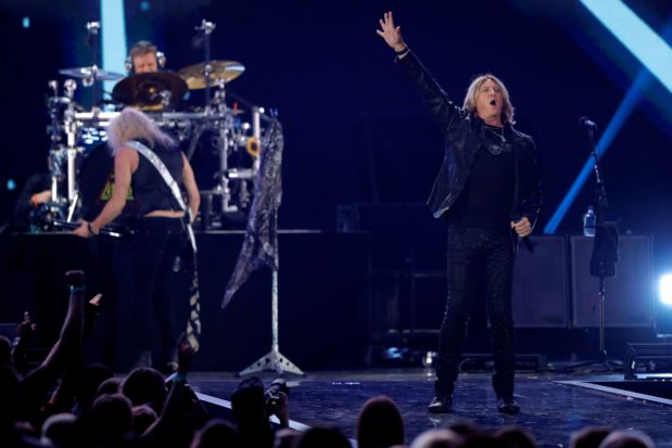 lead-singer-joe-elliott-r-performs-with-def-leppard-during-the-iheartradio-music-festival-at-t-mobile-arena-in-las-vegas