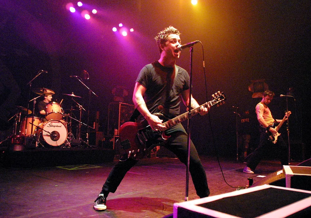 billie-joe-armstrong-center-performs-with-his-band-green-day-on-opening-night-of-their-latest-to-2