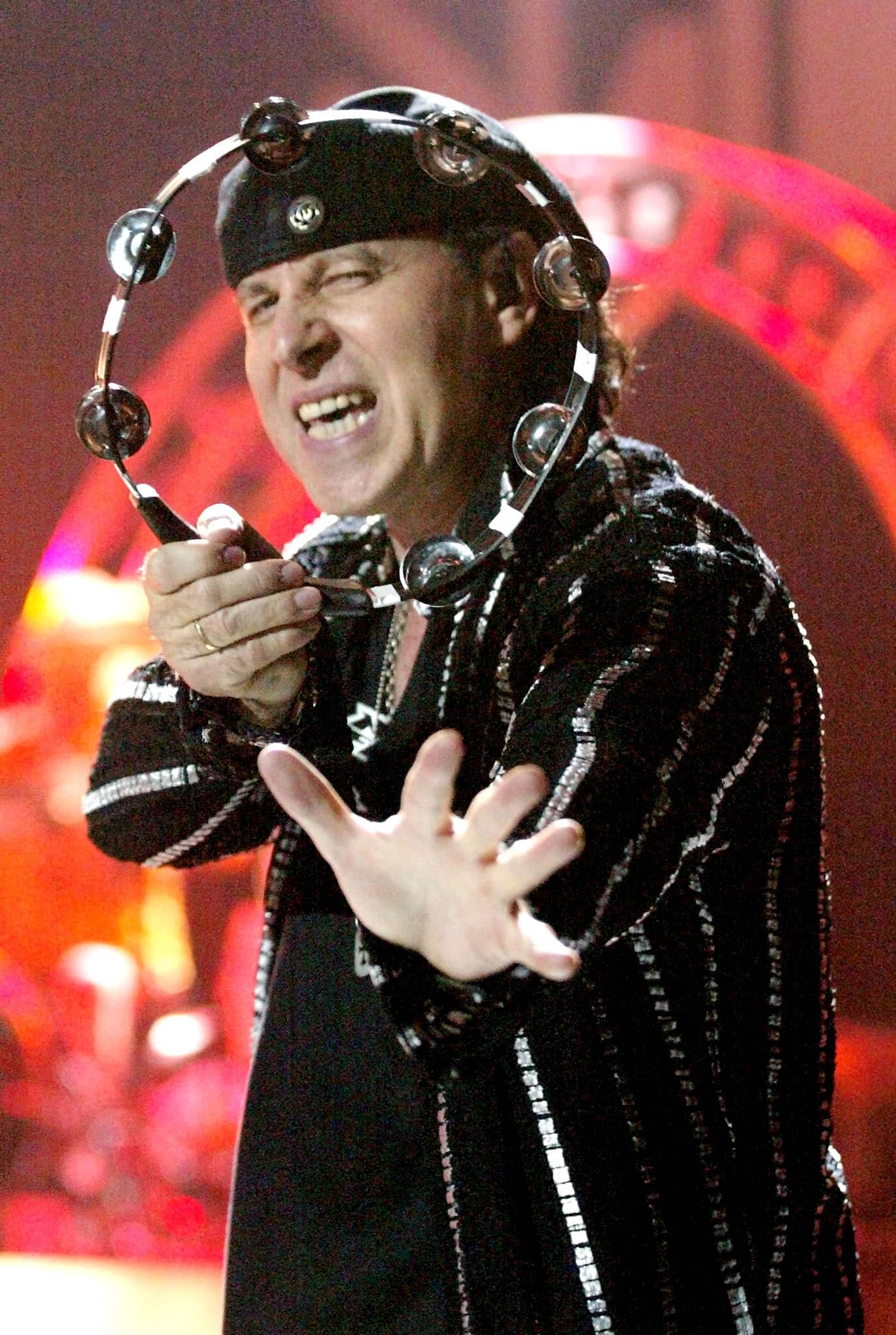 scorpions-singer-klaus-meine-is-seen-through-a-tambourine-as-he-performs-during-the-first-stop-of