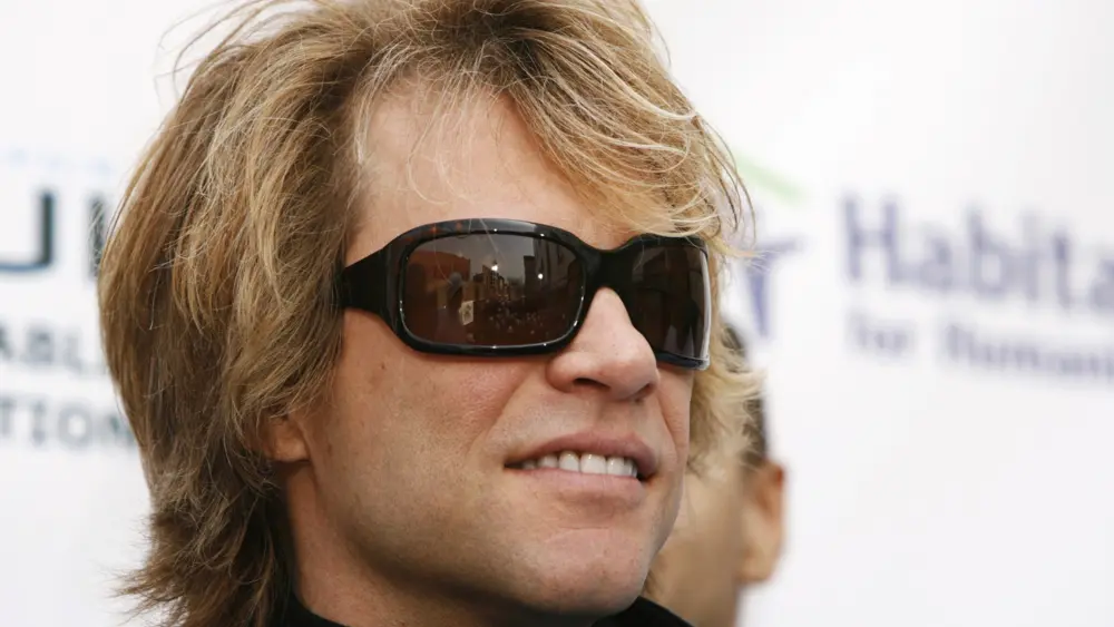 musician-jon-bon-jovi-smiles-before-speaking-at-a-habitat-for-humanity-building-site-in-brooklyn-new-york-6