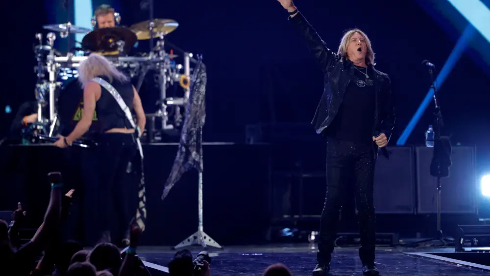lead-singer-joe-elliott-r-performs-with-def-leppard-during-the-iheartradio-music-festival-at-t-mobile-arena-in-las-vegas-10