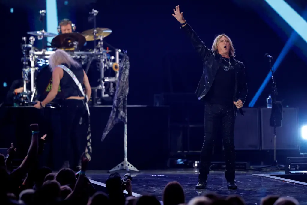 lead-singer-joe-elliott-r-performs-with-def-leppard-during-the-iheartradio-music-festival-at-t-mobile-arena-in-las-vegas-11