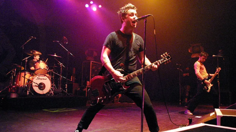 billie-joe-armstrong-center-performs-with-his-band-green-day-on-opening-night-of-their-latest-to-4