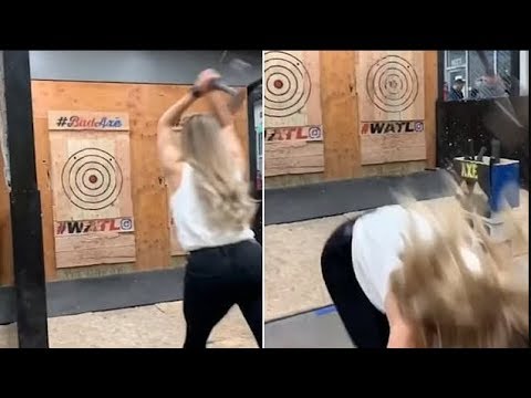 woman-is-almost-hit-by-axe-as-it-flies-back-during-throwing-game