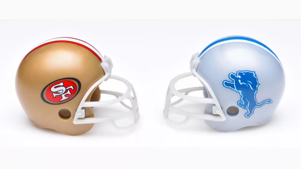 Football helmets of the San Francisco 49ers and Detroit Lions