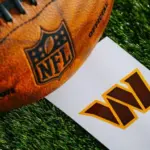 Washington Commanders NFL team Logo and American football ball on Green Grass.