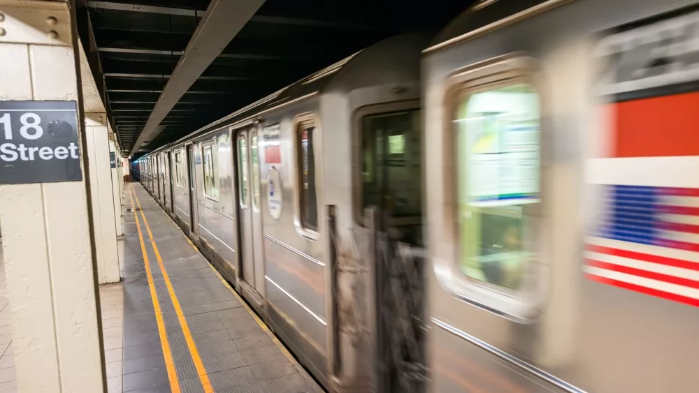 Fast moving train in New York subway. 18th street station.