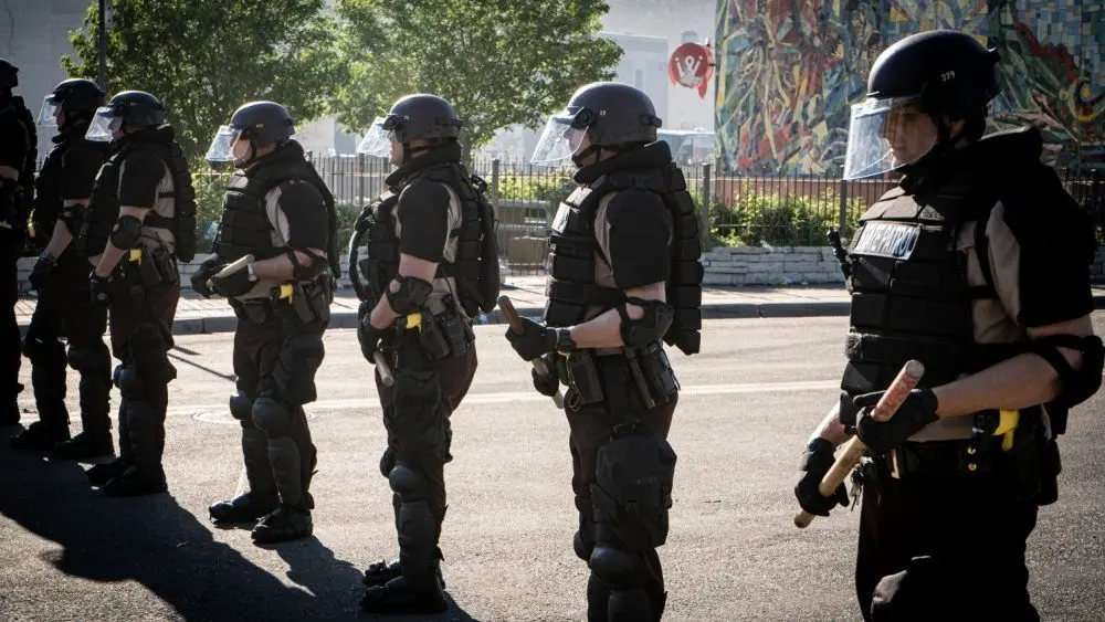 Minneapolis^ Minnesota / USA - May 29 2020: close up state patrol police officers standing guard towards minneapolis riots for George Floyd