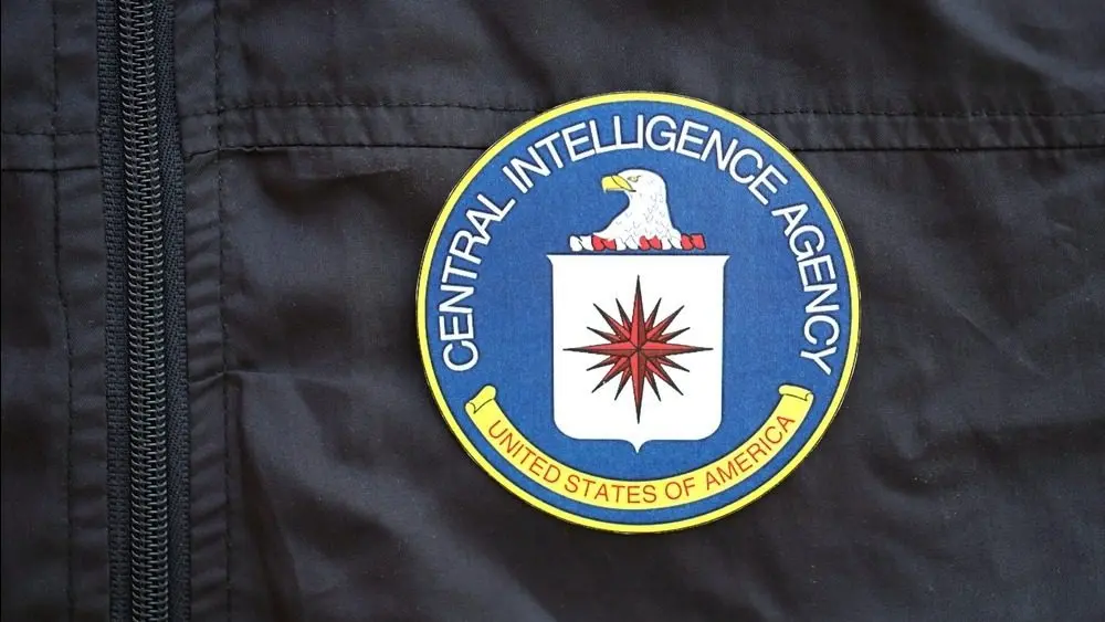United States of America Central Intelligence Agency coat of arms as pin on black uniform jacket close up