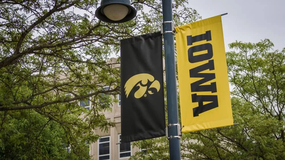 University of Iowa banner with Hawkeyes logo on college campus. Iowa City^ IA - May 23^ 2022: