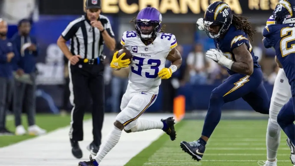 Minnesota Vikings running back Aaron Jones in runs against the Los Angeles Chargers during an NFL football game Oct. 23^ 2025^ in Inglewood^ Calif.