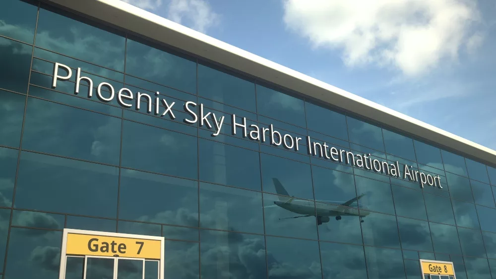 Airliner landing reflecting in the windows with phoenix sky harbor international airport text 3D rendering