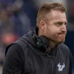 NCAA Football: South Florida at Navy: Nov 15, 2025; Annapolis, Maryland, USA;  South Florida Bulls head coach Alex Golesh looks on the field during the second half against the Navy Midshipmen at Navy-Marine Corps Memorial Stadium. Navy Midshipmen defeated South Florida Bulls 41-28. Mandatory Credit: Tommy Gilligan-Imagn Images
