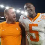 NCAA Football: Tennessee at Pittsburgh: Sep 10, 2022; Pittsburgh, Pennsylvania, USA;  Tennessee Volunteers offensive coordinator Alex Golesh (left) and quarterback Hendon Hooker (5) celebrate as they leave the field after defeating the Pittsburgh Panthers at Acrisure Stadium. Tennessee won 34-27 in overtime. Mandatory Credit: Charles LeClaire-USA TODAY Sports