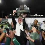 NCAA Football: Hawai: Dec 24, 2024; South Florida Bulls head coach Alex Golesh lifts the winning trophy after his team defeated the San Jose State Spartans in five overtimes at Clarence T.C. Ching Athletics Complex. Mandatory Credit: Marco Garcia-Imagn Images