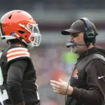 NFL: Pittsburgh Steelers at Cleveland Browns: Dec 28, 2025; Cleveland, Ohio, USA; Cleveland Browns head coach Kevin Stefanski speaks with quarterback Shedeur Sanders (12) during a time out in the second quarter against the Pittsburgh Steelers at Huntington Bank Field. Mandatory Credit: Scott Galvin-Imagn Images