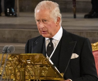 Britain unveils King Charles III's royal insignia, postage stamp