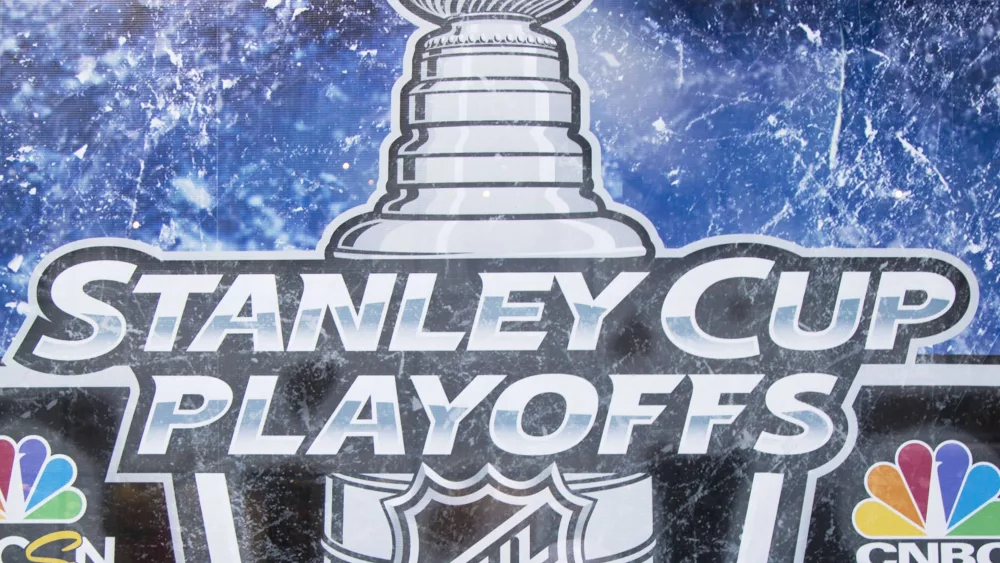 Stanley Cup Playoffs logo displayed at the NBC Experience Store window in midtown Manhattan