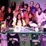 Kailee Sanchez and Marissa Obregon pose with their Lady Winds teammates after signing their National Letters of Intent to play softball at the collegiate level on April 27, 2022. (Ryan Crowe/FCR)
