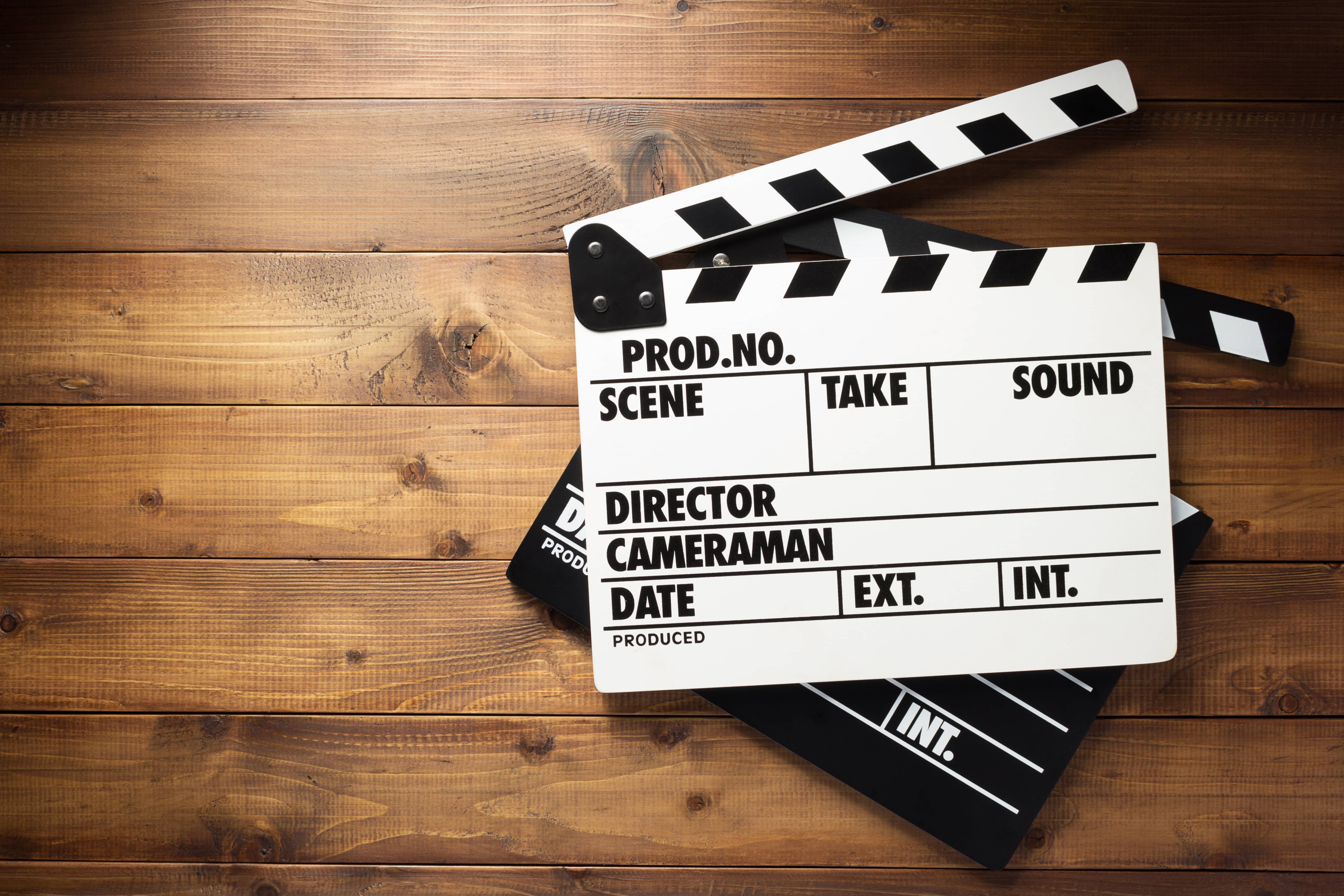 movie-clapper-board-at-wooden-background