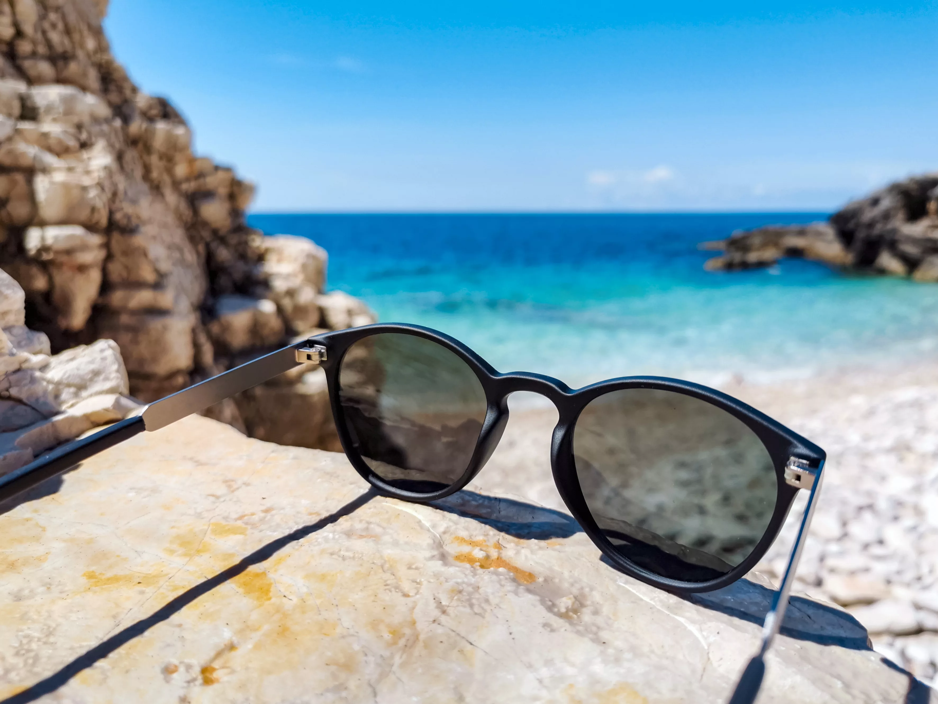 close-up-image-of-sunglasses-on-beach-in-summer-2022-11-14-17-35-26-utc