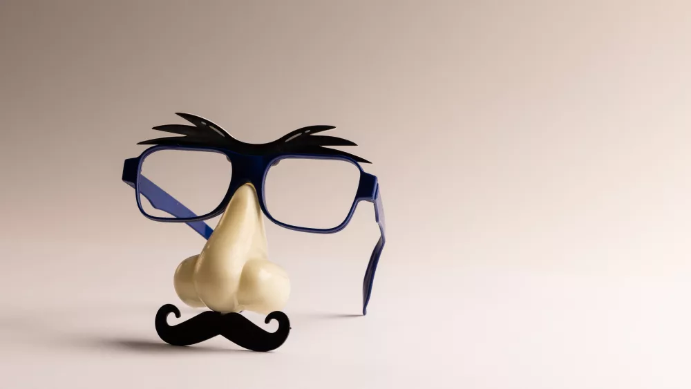 composition-of-fake-mask-with-glasses-and-moustache-on-white-background-with-copy-space-fake-moustache-day-party-celebration-and-costume-concept