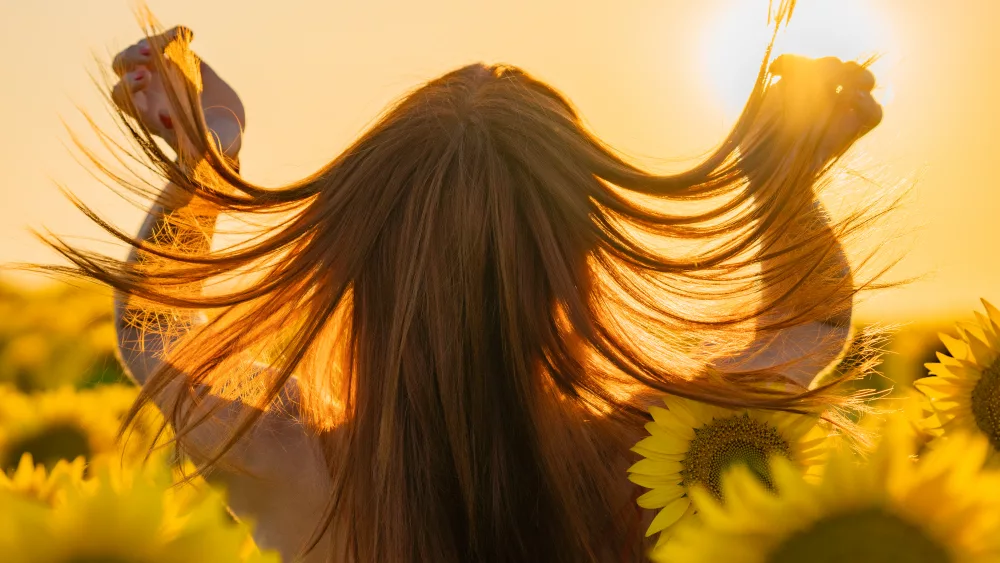 woman-in-sunflower-field-during-sunset