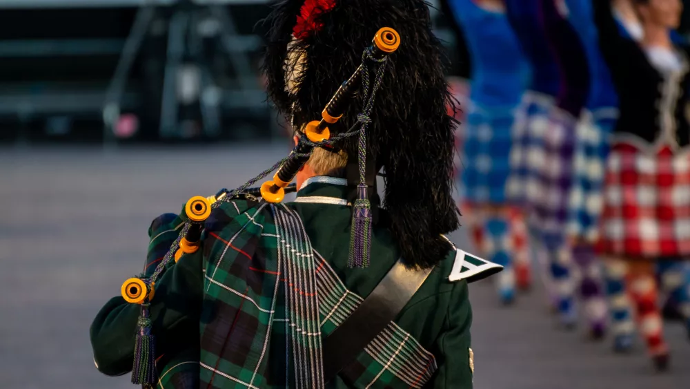 close-up-of-a-man-in-traditional-scottish-attire-is-playing-the-traditional-scottish-bagpipes
