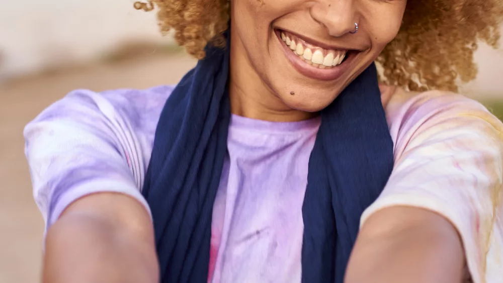 portrait-of-happy-woman-holding-mans-hand