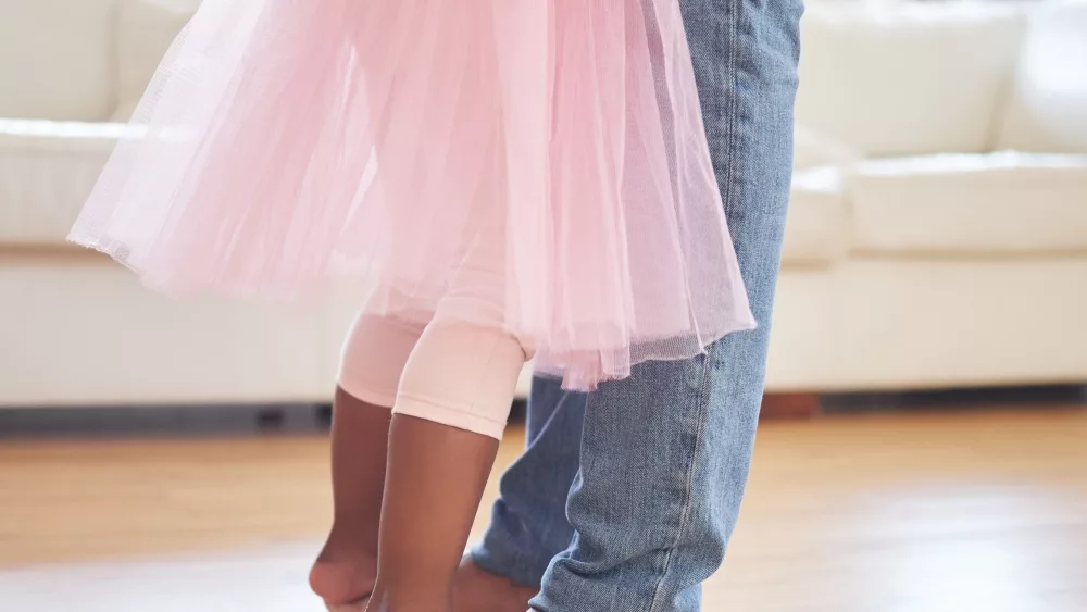 closeup-of-father-and-daughter-dancing-a-little-a-2024-06-27-22-19-43-utc