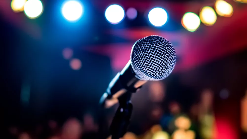 microphone-on-stage-against-a-background-of-auditorium