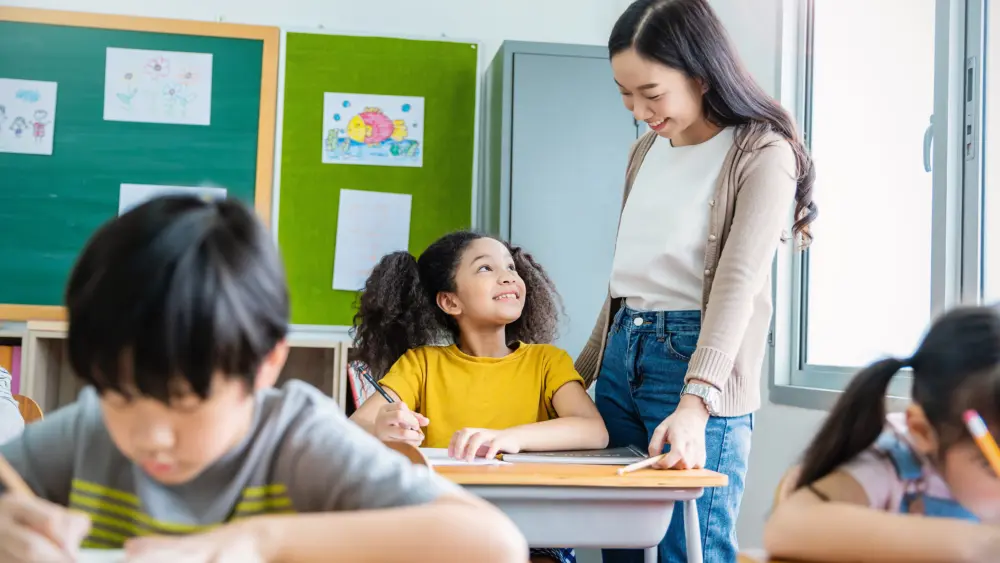 pupil-black-girl-with-teacher-in-classroom-at-elem-2025-07-18-16-45-25-utc