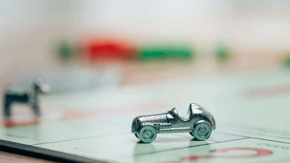 kyiv-ukraine-november-15-2019-selective-focus-of-playing-figure-on-monopoly-game-on-table