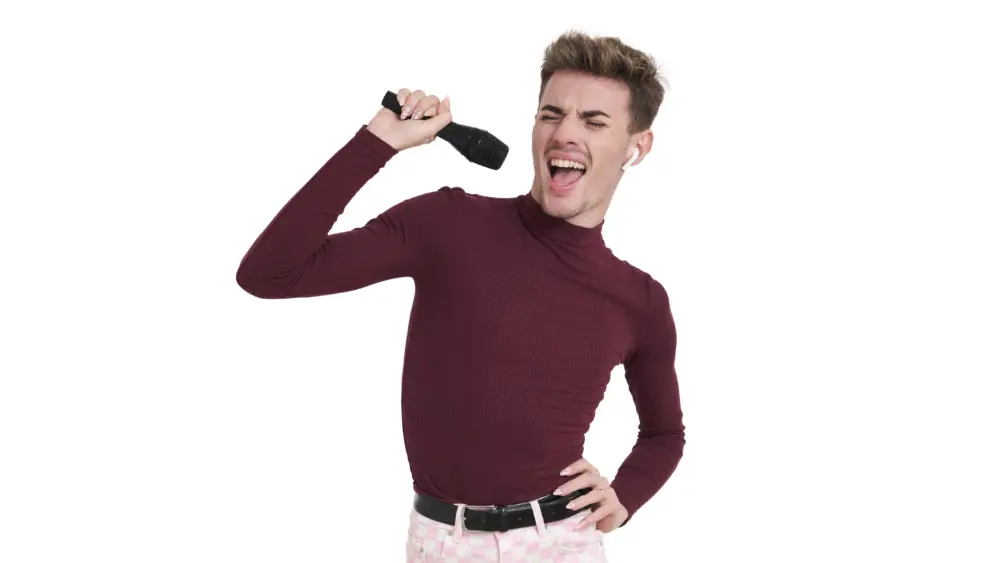 young-caucasian-man-singing-with-a-microphone-isolated