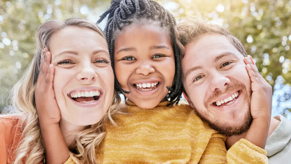 girl-adoption-and-bonding-parents-in-garden-natu-2026-01-09-11-43-44-utc