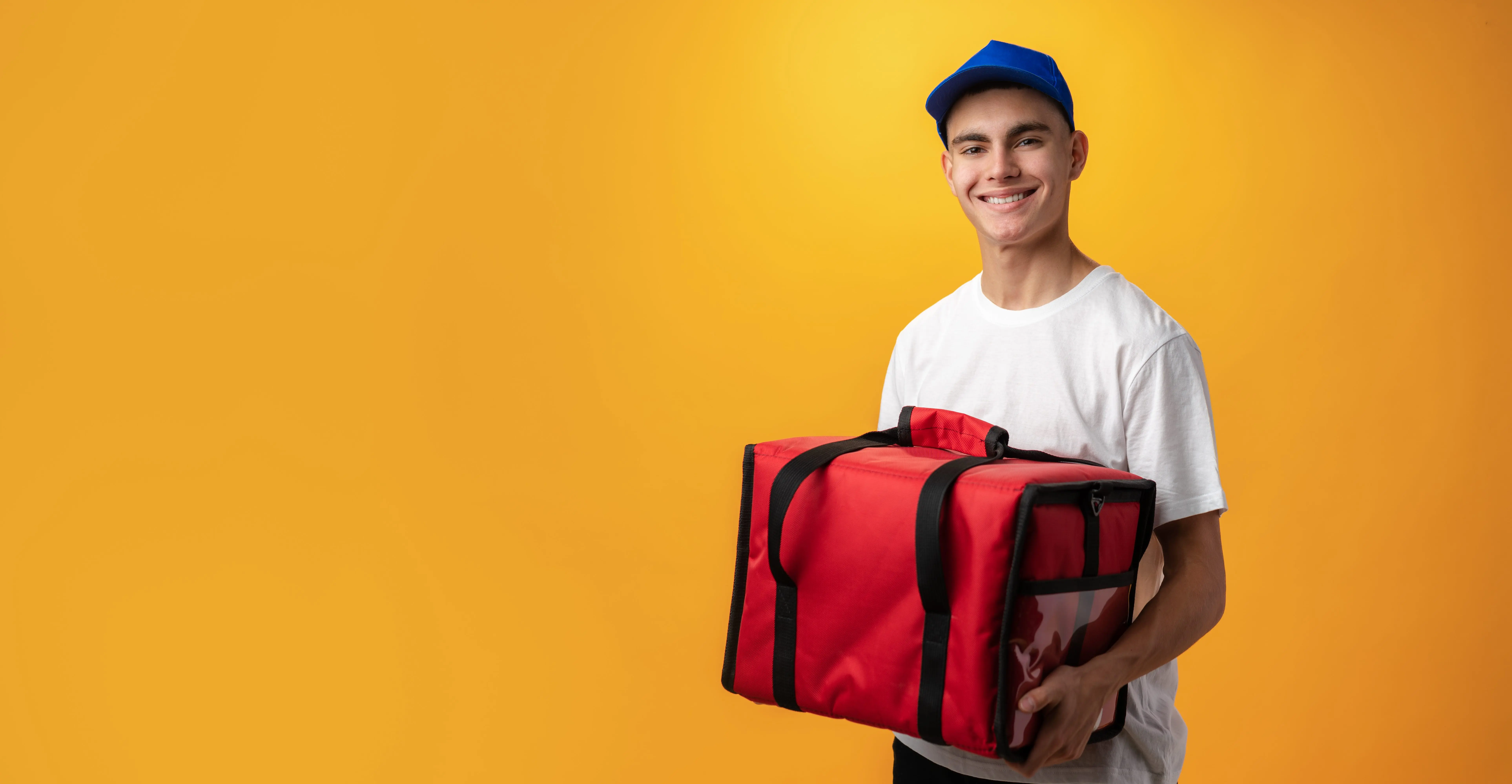 portrait-of-pizza-delivery-boy-with-thermal-bag-against-yellow-background